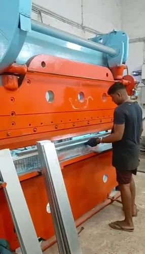 Metal bending machine in operation